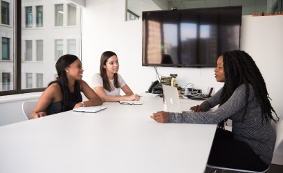 three women sitting at the table